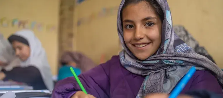 young girl in unicef supported school