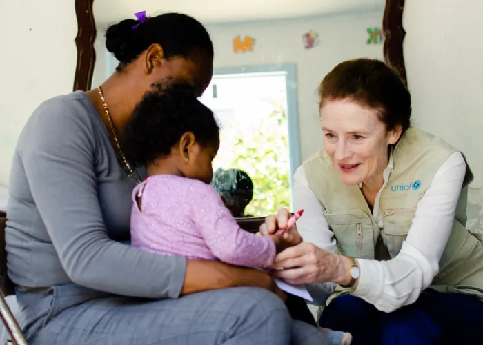 On 19 June 2019 in Tijuana, Mexico (right) UNICEF Executive Director Henrietta H. Fore speaks with [NAME CHANGED] Nadia and her one-year old child. Nadia is from Guerrero, Mexico. She had to leave her home due to extortion, she was scared for her and her daughter. Now she wants to go to the US to look for better opportunities and to feel safe again.